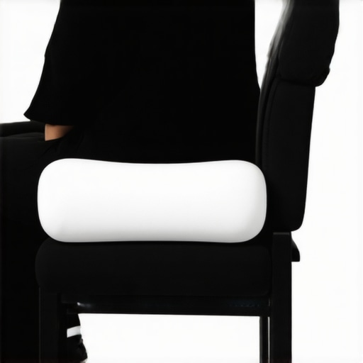 A person using a lumbar roll in an office chair to support the lower back curve.
